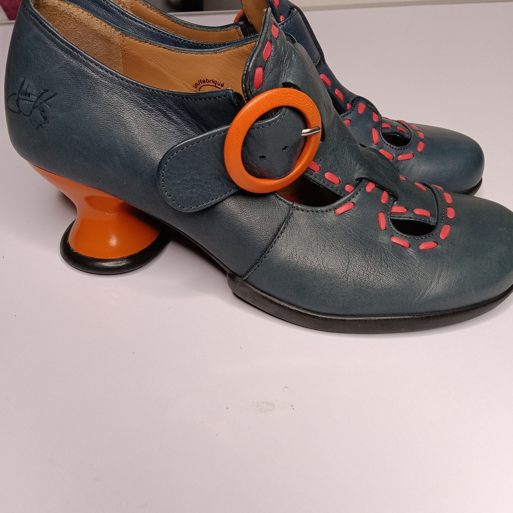 John Fluevog Black and Orange Clogs with Bold Design